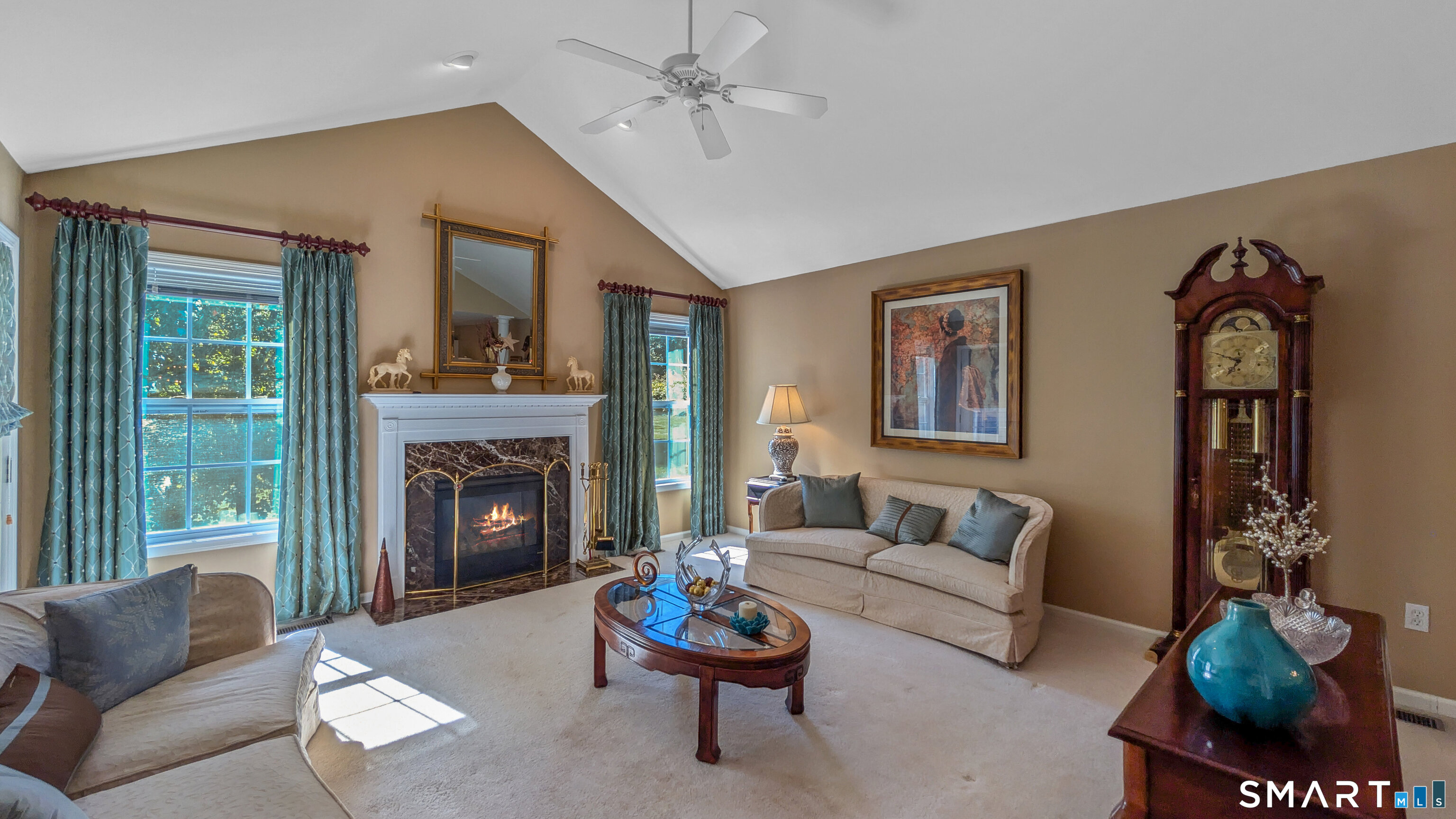 123 Louis Hill Road, Unit 123 Newtown, CT 06482 - Photo 5 of 35 a living room with furniture and a fireplace
