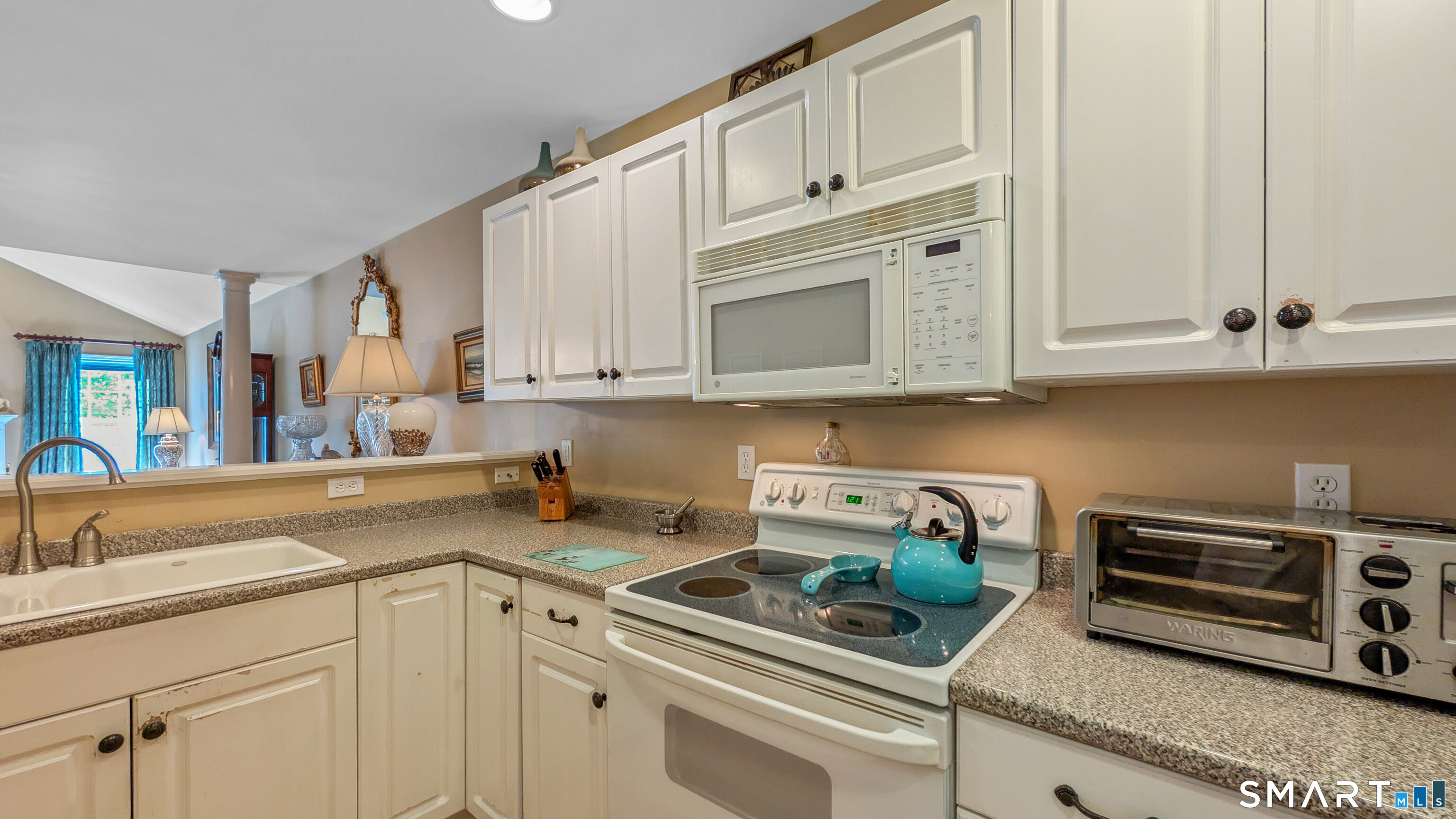 123 Louis Hill Road, Unit 123 Newtown, CT 06482 - Photo 9 of 35 a kitchen with appliances a sink and cabinets