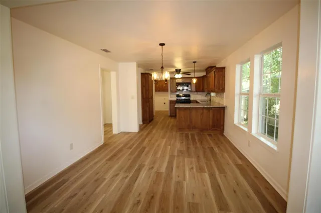 a view of a kitchen with a large window
