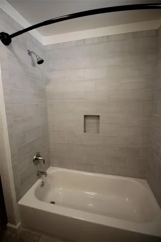 a bathroom with a shower and a bathtub