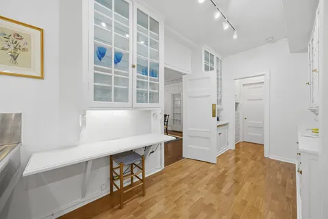 a kitchen with a refrigerator and a sink