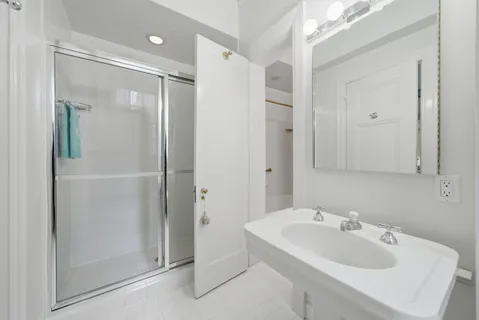 a bathroom with a sink and mirror