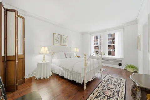 a bed room with a bed and a window