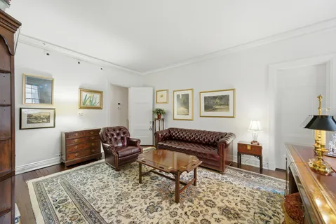 a living room with furniture and a rug
