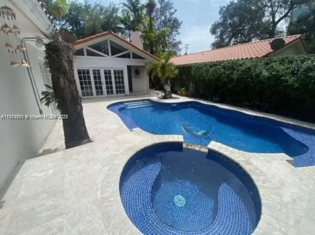 a view of outdoor kitchen and patio