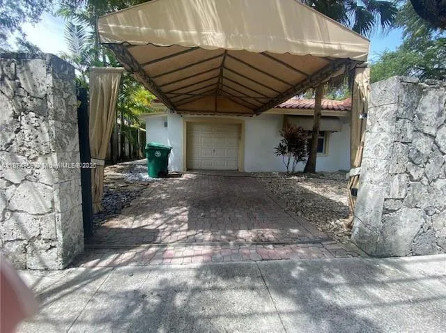 a view of the house with a yard