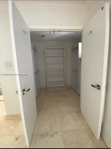 a kitchen with a sink and a refrigerator