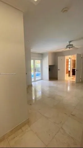 a view of livingroom with furniture and front door