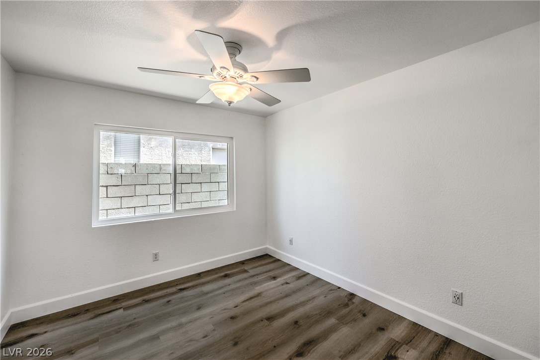 1900 Cardinal Point Street Henderson, NV 89012 - Photo 18 of 32 An airy bedroom with wood flooring and a refreshing ceiling fan awaits.