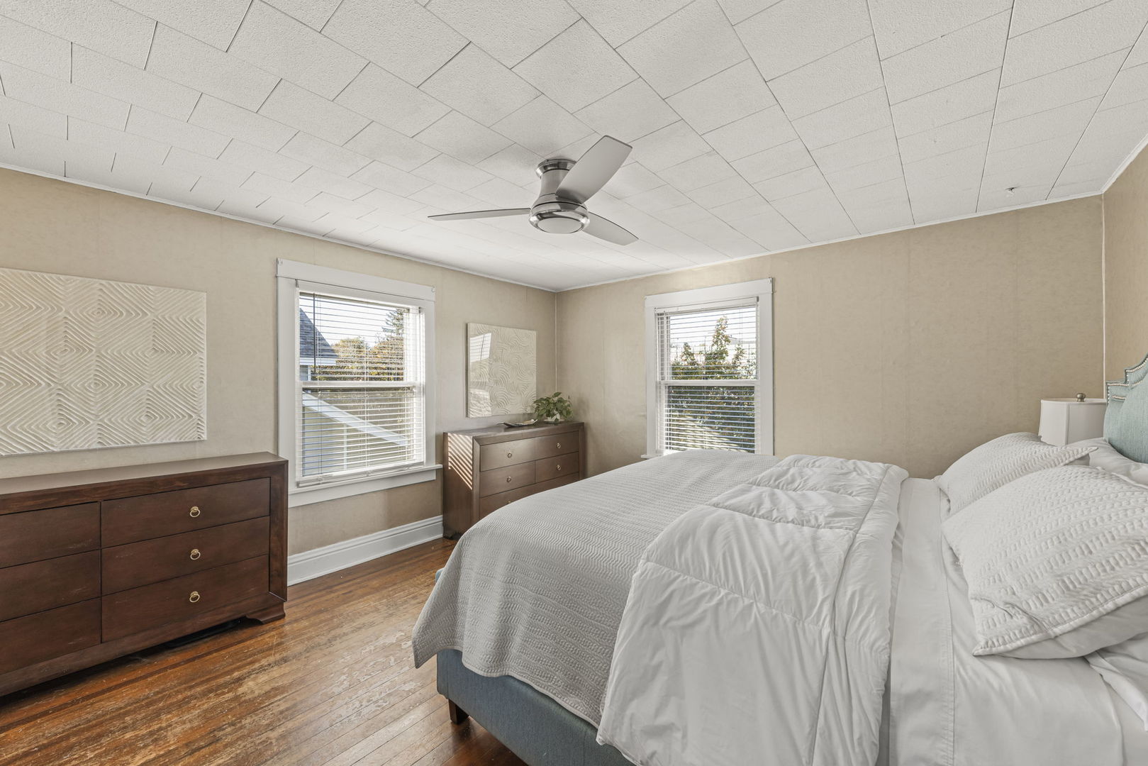 116 Columbia Street Naperville, IL 60540 - Photo 17 of 27 a spacious bedroom with a bed and a dresser