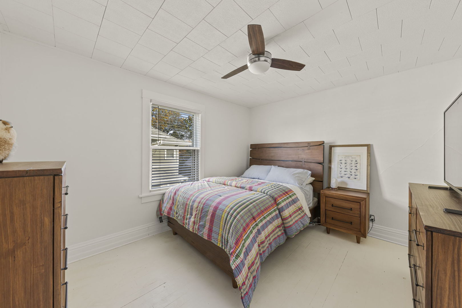 116 Columbia Street Naperville, IL 60540 - Photo 20 of 27 a bedroom with a bed and a chandelier