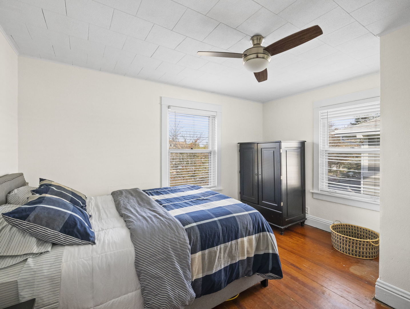 116 Columbia Street Naperville, IL 60540 - Photo 22 of 27 a bedroom with a bed and wooden floor