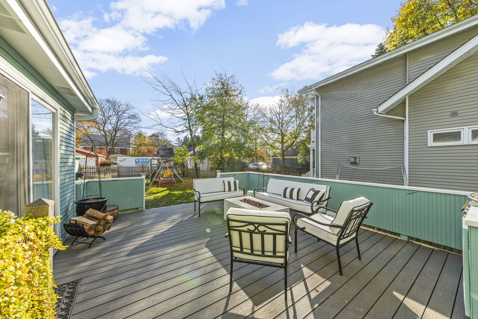 116 Columbia Street Naperville, IL 60540 - Photo 23 of 27 a view of a patio with a dining table and chairs with wooden floor