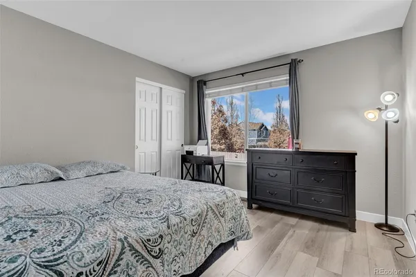 a bedroom with a bed and a dresser