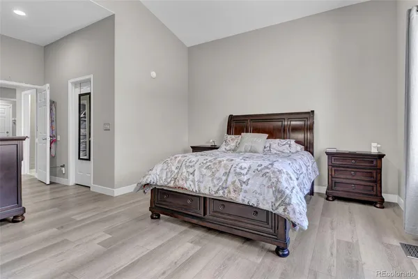 a room with a chair and a wooden floor