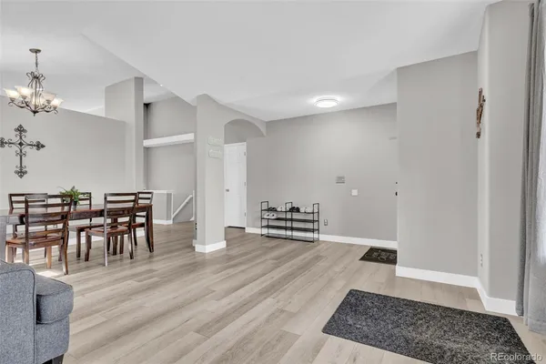a view of a dining room with furniture and wooden floor