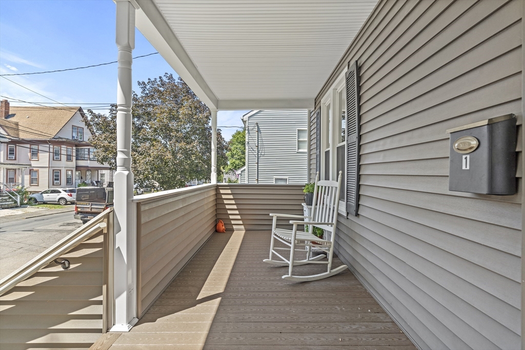 30 Chester Avenue, Unit 1 Waltham, MA 02453 - Photo 13 of 14 a view of balcony with wooden floor and fence