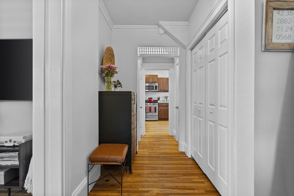 30 Chester Avenue, Unit 1 Waltham, MA 02453 - Photo 3 of 14 a hallway with a door and a hallway