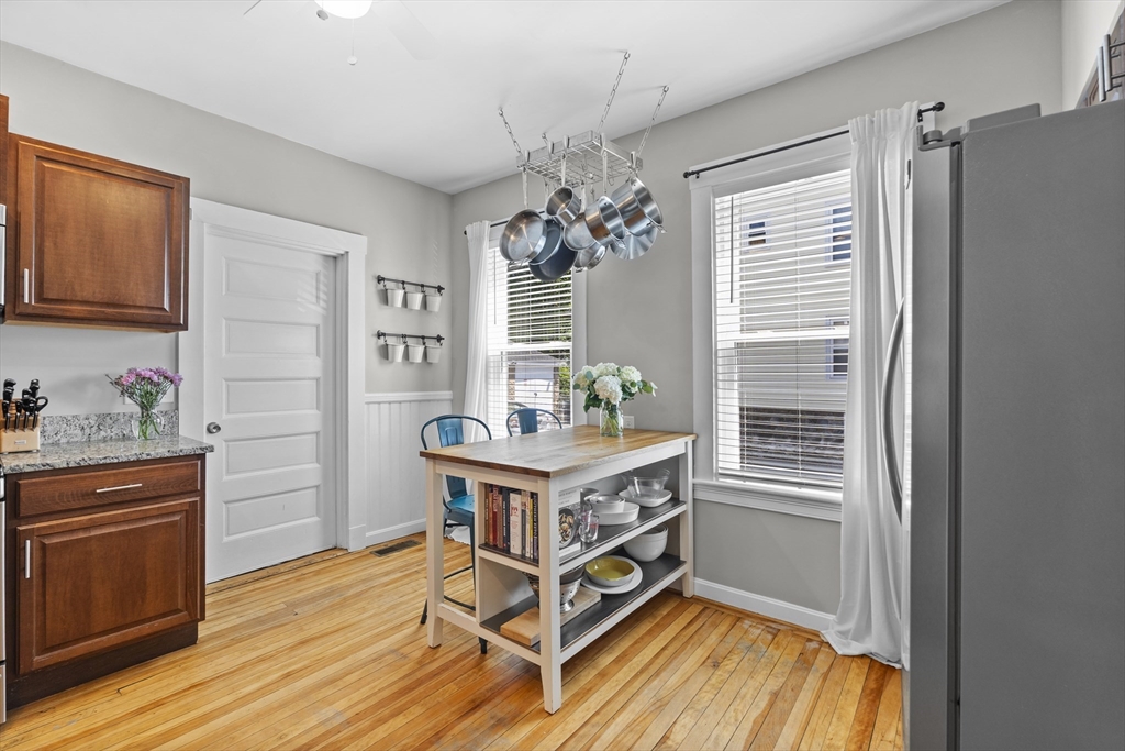 30 Chester Avenue, Unit 1 Waltham, MA 02453 - Photo 6 of 14 a living room with stainless steel appliances furniture and a window