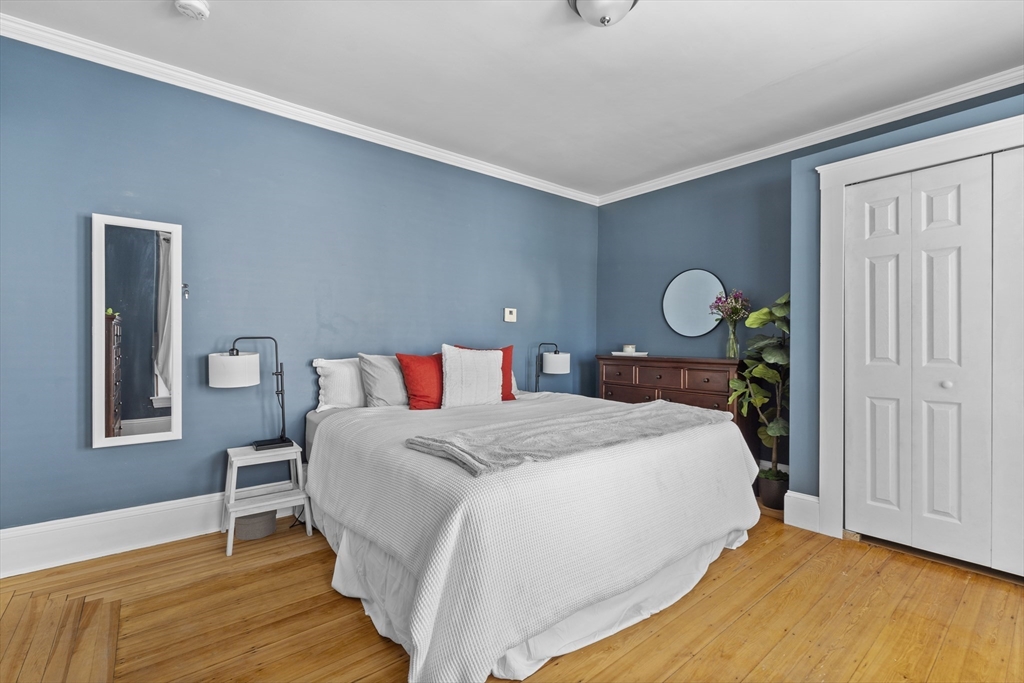 30 Chester Avenue, Unit 1 Waltham, MA 02453 - Photo 7 of 14 a bedroom with bed and window