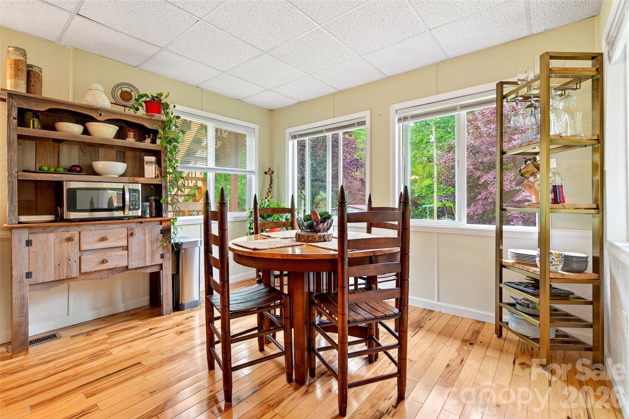227 Locust Cove Road Marion, NC 28752 - Photo 9 of 34 a dining room with furniture window and wooden floor