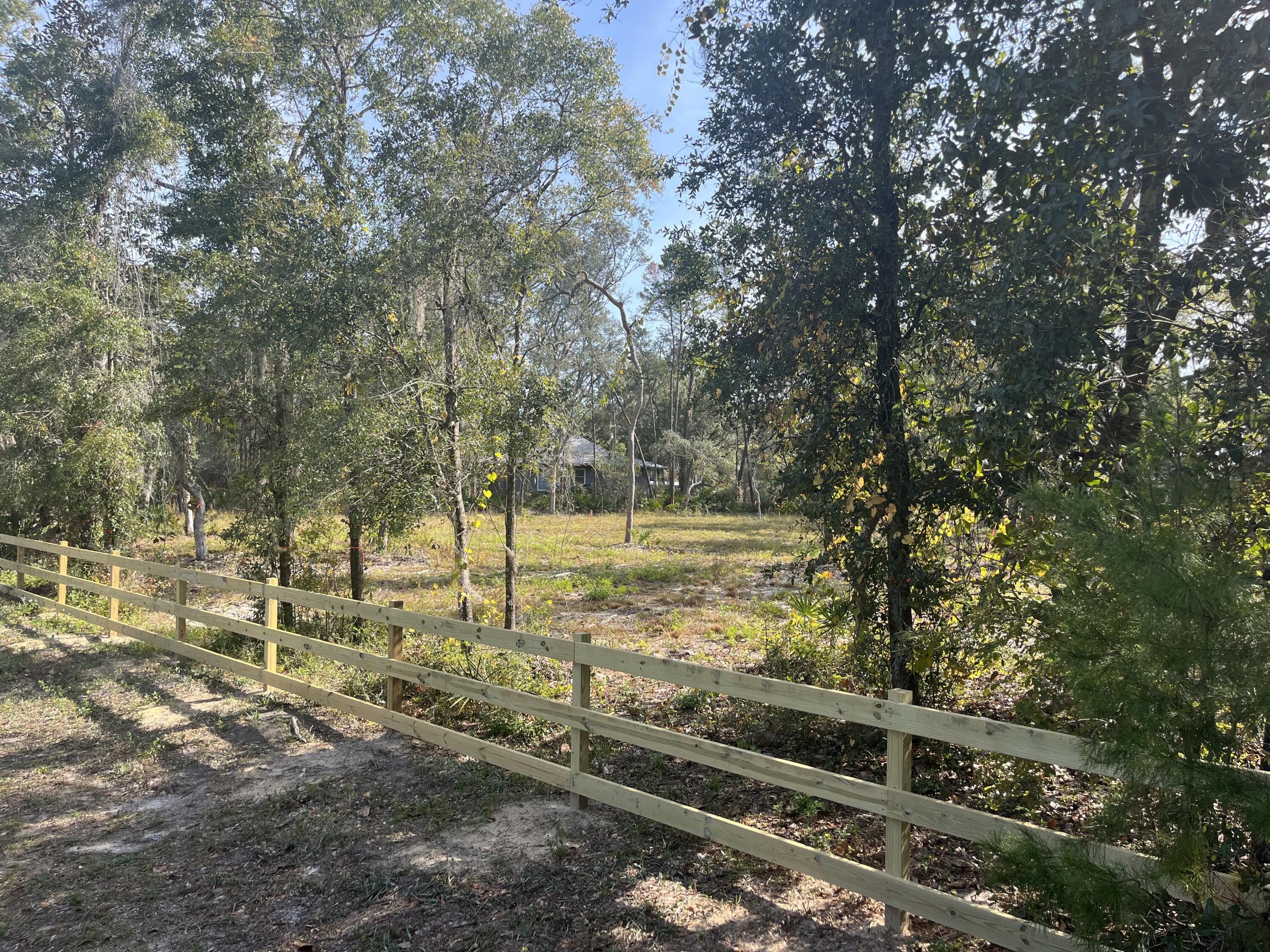 Lot 2 Eden Drive Santa Rosa Beach, FL 32459 - Photo 3 of 4 a view of a yard with wooden fence