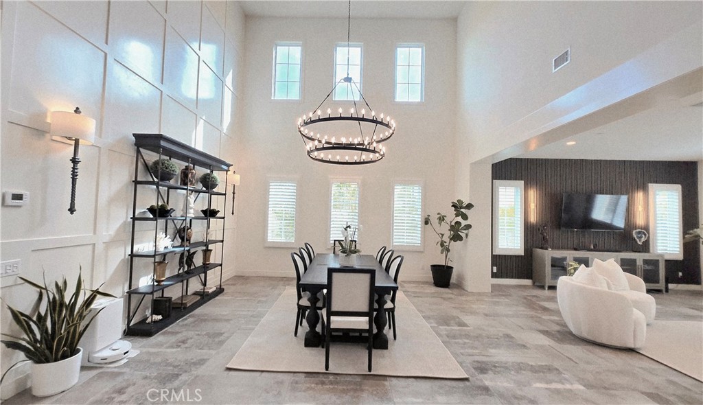 56 Redshift Irvine, CA 92618 - Photo 11 of 67 a dining room with furniture and a large window