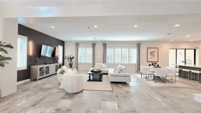 a large kitchen with a table and chairs