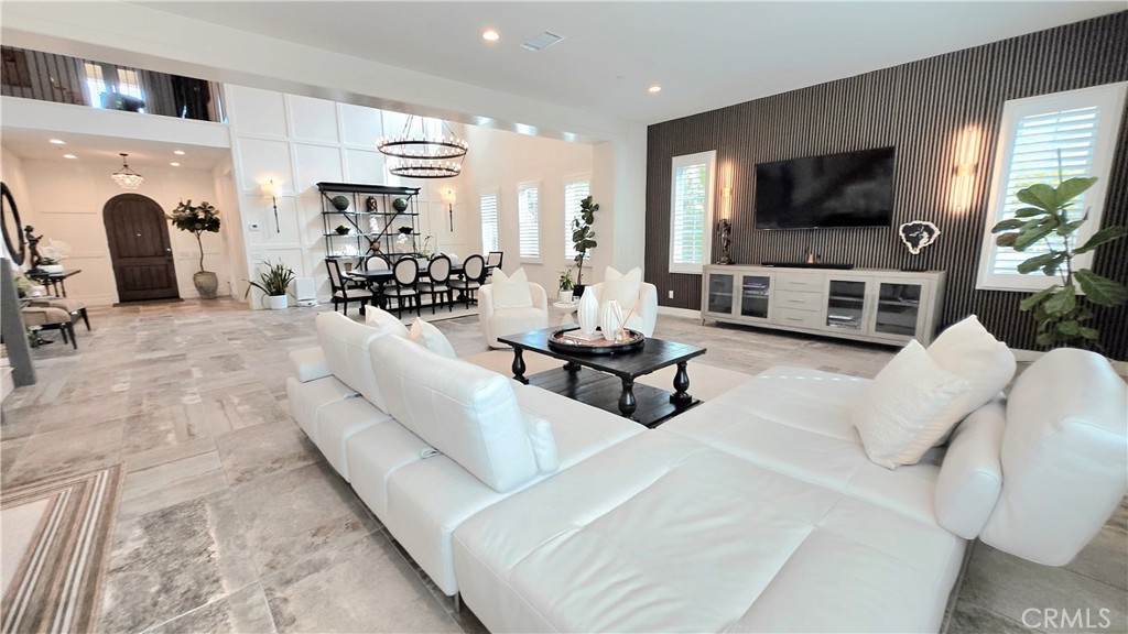 56 Redshift Irvine, CA 92618 - Photo 18 of 67 a living room with furniture and a flat screen tv