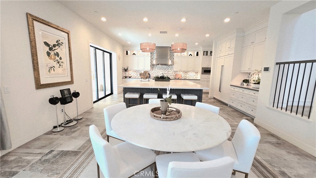 56 Redshift Irvine, CA 92618 - Photo 22 of 67 a large kitchen with a table and chairs