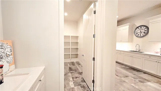 a bedroom with a bed next to a window