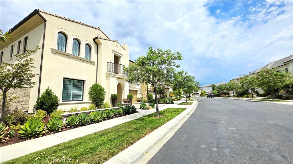 56 Redshift Irvine, CA 92618 - Photo 4 of 67 a front view of house and yard with green space