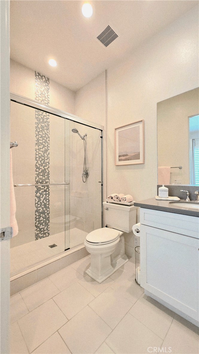 56 Redshift Irvine, CA 92618 - Photo 45 of 67 a bathroom with a toilet sink and shower