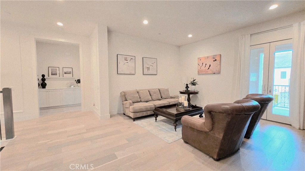 56 Redshift Irvine, CA 92618 - Photo 48 of 67 a living room with furniture and a potted plant