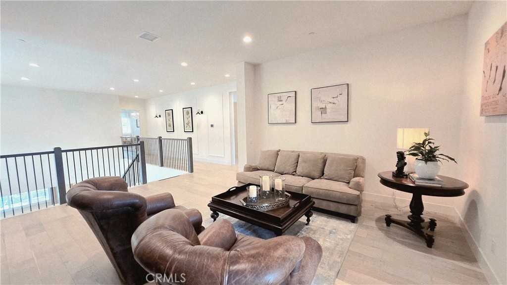 56 Redshift Irvine, CA 92618 - Photo 49 of 67 a living room with furniture and a rug