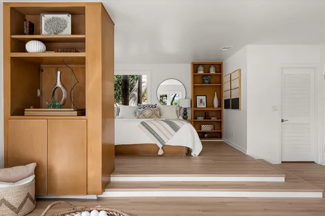 a view of living room filled with furniture and window