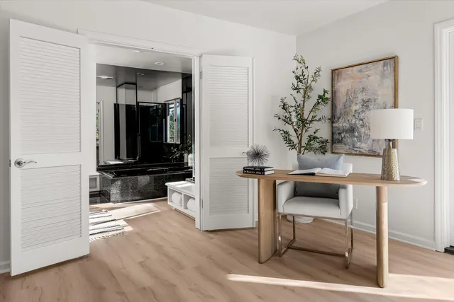 a view of living room with furniture and wooden floor