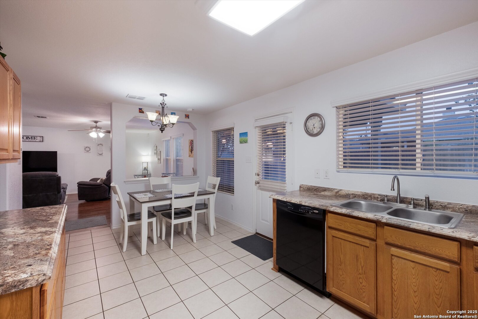 10711 Rindle Ranch San Antonio, TX 78249 - Photo 13 of 31 a dining table with chairs and window