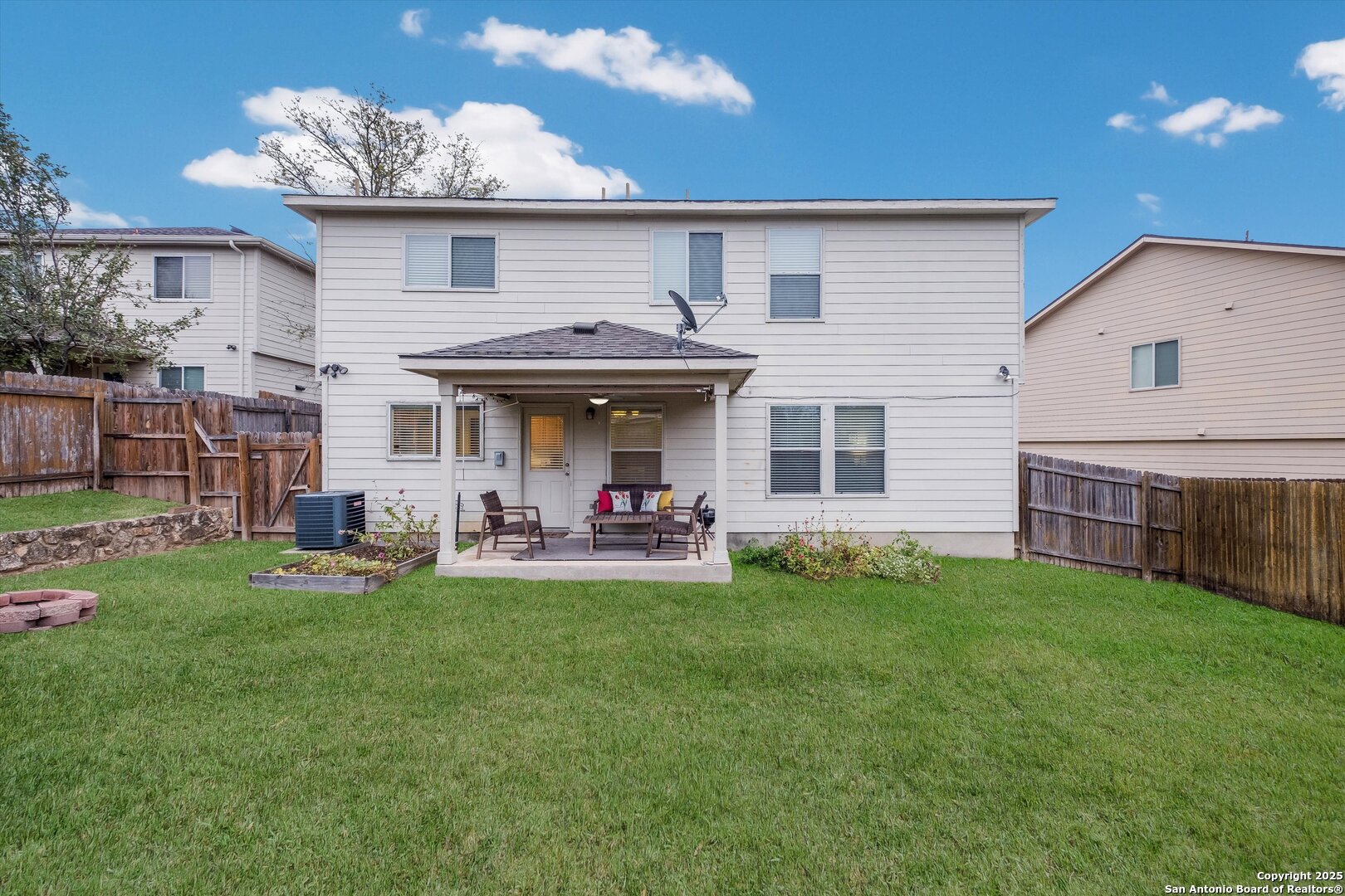 10711 Rindle Ranch San Antonio, TX 78249 - Photo 28 of 31 a view of a house with a yard and sitting area