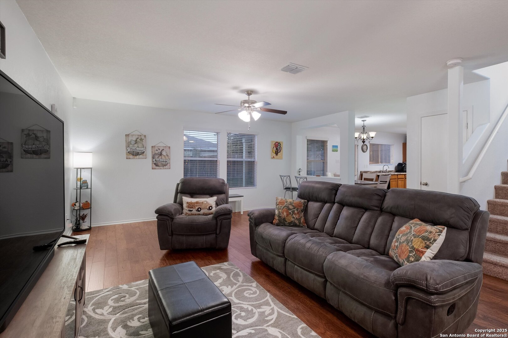 10711 Rindle Ranch San Antonio, TX 78249 - Photo 5 of 31 a living room with furniture and a flat screen tv