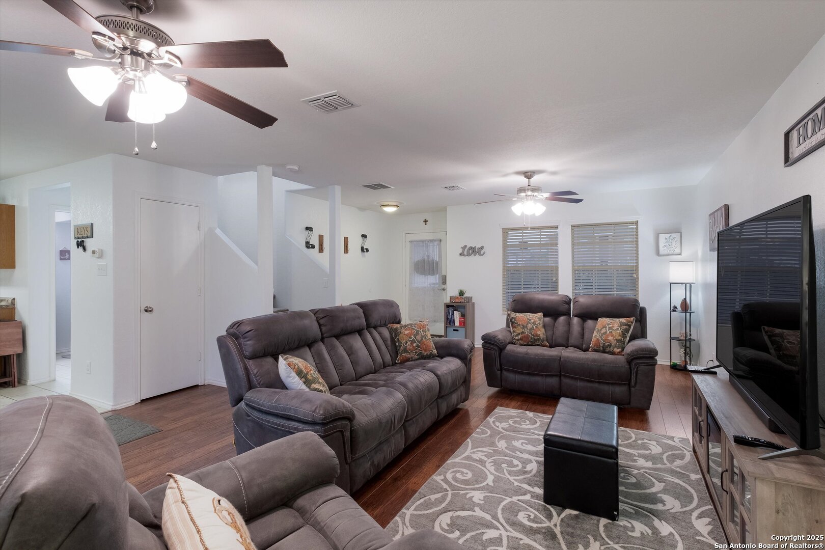 10711 Rindle Ranch San Antonio, TX 78249 - Photo 7 of 31 a living room with furniture and a flat screen tv