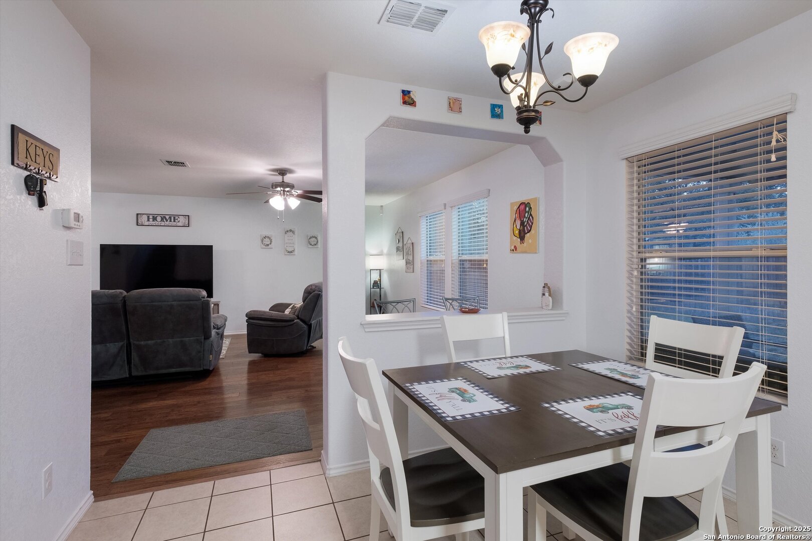 10711 Rindle Ranch San Antonio, TX 78249 - Photo 9 of 31 a living room with granite countertop furniture and a fireplace