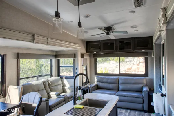 a living room with furniture and a window