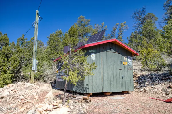 a view of a barn in the middle of a yard