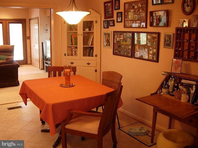 15212 Redgate Drive Silver Spring, MD 20905 - Photo 11 of 28 a dining room with furniture and window