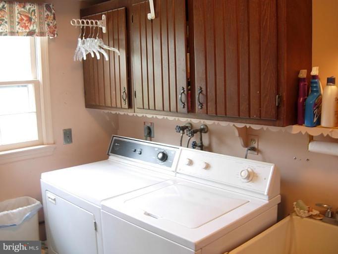 15212 Redgate Drive Silver Spring, MD 20905 - Photo 17 of 28 a utility room with dryer and washer