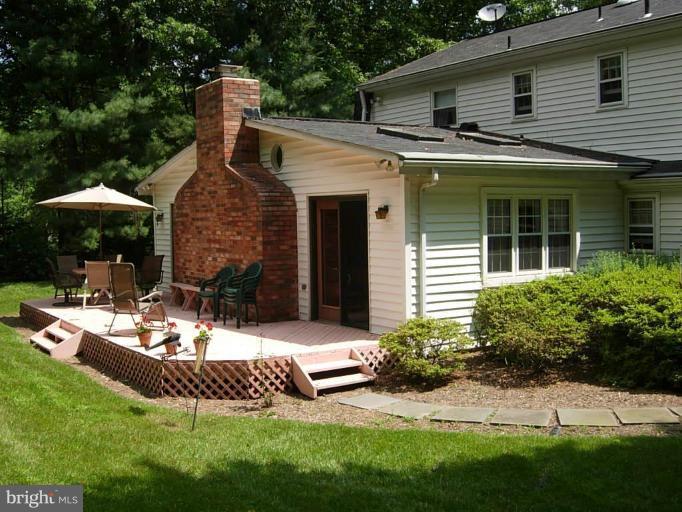 15212 Redgate Drive Silver Spring, MD 20905 - Photo 28 of 28 a view of a house with backyard and sitting area