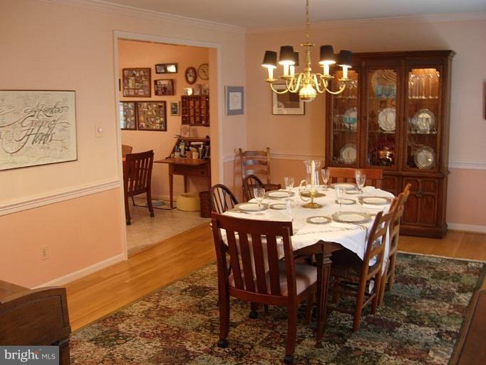 15212 Redgate Drive Silver Spring, MD 20905 - Photo 4 of 28 a dining room with wooden floor and breakfast area