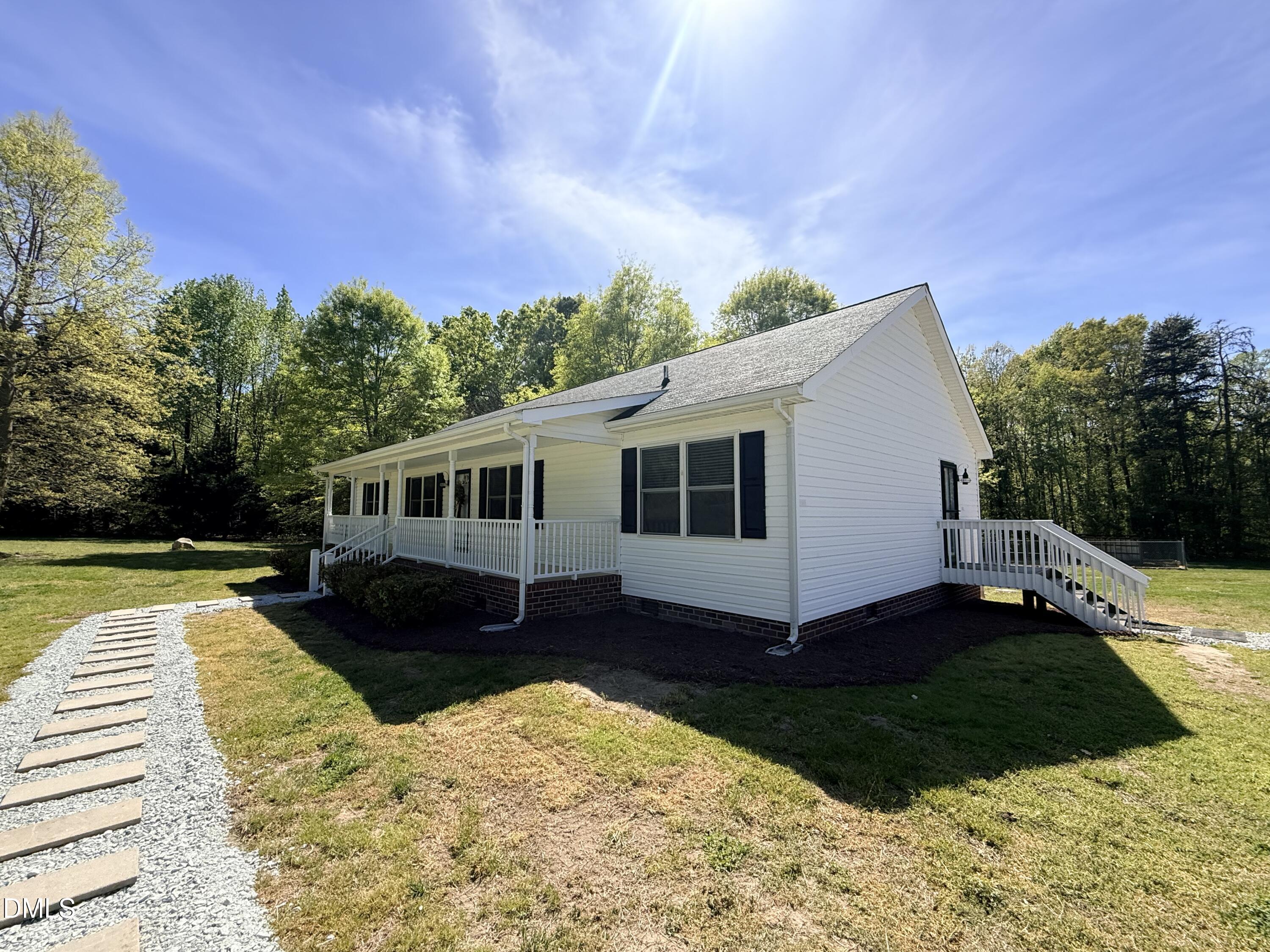 2429 Halifax Road Roxboro, NC 27573 - Photo 54 of 54 a view of a house with a yard