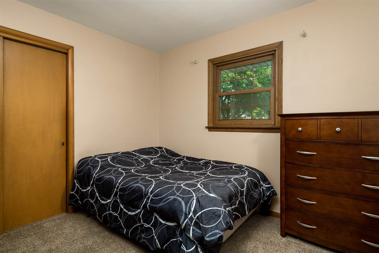 1104 Brookfield Road Rockford, IL 61107 - Photo 11 of 22 a bedroom with a bed and a window